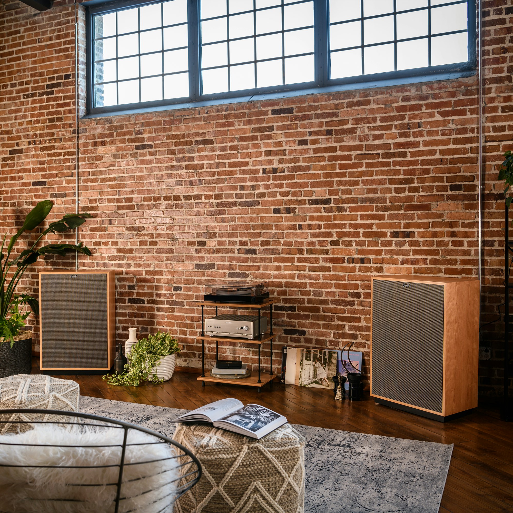 Cornwall IV speakers in a turntable listening configuration with a cozy seating area in front